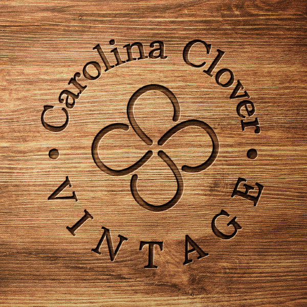 Wood burn rendering of Carolina Clover Vintage logo